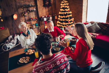 Portrait of big friendly family speak laugh eat x-mas new year celebration flat indoorsの写真素材