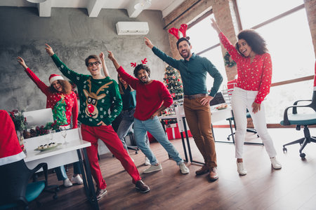 Full length photo of six office workers dance rejoice festive corporate party business center indoorsの写真素材
