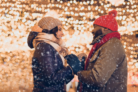 Photo of pretty sweet husband wife wear winter season clothes enjoying xmas miracle outside urban city streetの写真素材