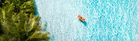 Top above high angle aerial drone view of fit attractive girl floating on rubber mattress clear clean sea water idyllic harmony leisure sunny weather famous direction relax tranquil tour countryの写真素材