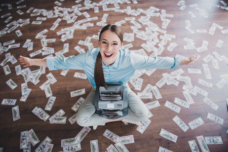 Photo of cheerful positive lady broker wear shirt eyeglasses counting money indoors workplace workshopの写真素材