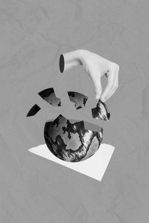 Vertical collage image of black white gamma human arm fingers hold pieces destroyed crashed planet earth globe isolated on grey backgroundの写真素材