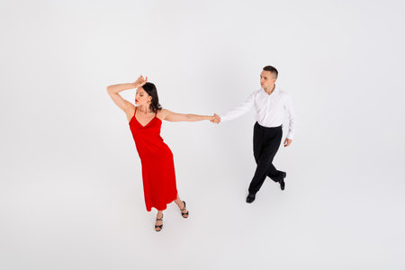 Full size high angle view photo of two young dancing partners performing isolated on white color backgroundの写真素材