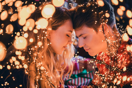 Photo of pretty young couple touch forehead gentle dressed christmas garment tradition atmosphere...