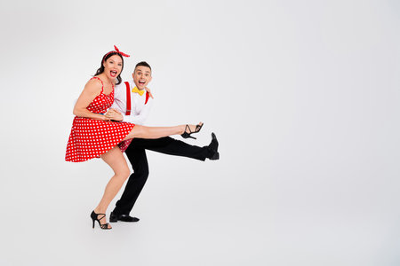 Photo of lovely attractive couple professional dancers active cha cha step dance event isolated on white color backgroundの写真素材