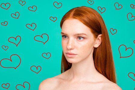 Advertising anti-age concept. Close-up portrait of nude natural nice red-haired girl with shiny pure clean smooth flawless skin, spa, therapy, treatment, isolated on green turquoise backgroundの写真素材