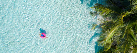 Top above high angle aerial drone view of her she attractive girl floating on rubber ring in ocean...