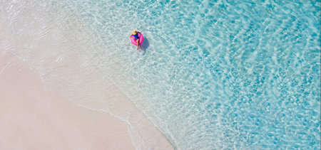 Top above high angle aerial drone view of her she attractive girl floating on rubber ring ocean...