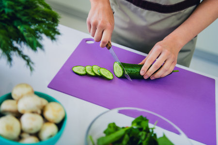 Close up photo of female chef preparing tasty dish modern kitchen home house day light indoorsの写真素材