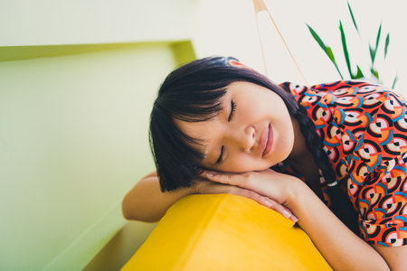 Photo of pretty young woman sleep couch wear shirt weekend modern interior apartment indoorsの写真素材