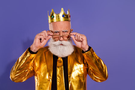 Photo of old man strict annoyed take off sunglass dressed glamour stylish golden outfit party isolated on purple color backgroundの写真素材