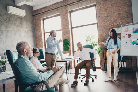 Full length photo of teamwork startup partners brainstorm boardroom conference comfortable nice...