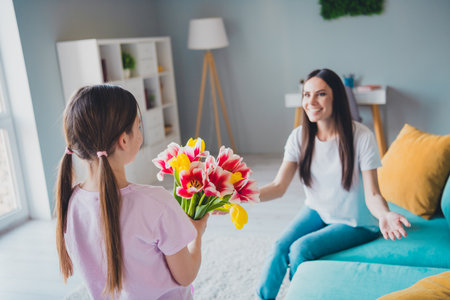 Photo of pretty cute cheerful mommy and pretty sweet daughter holiday together weekend indoorsの写真素材