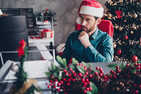 Photo of young handsome man working in a modern office new year morning corporate theme party workspace indoorsの写真素材