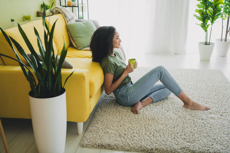 Full size profile photo of pretty young woman hold coffee inspiration pastime living room apartment indoorsの写真素材