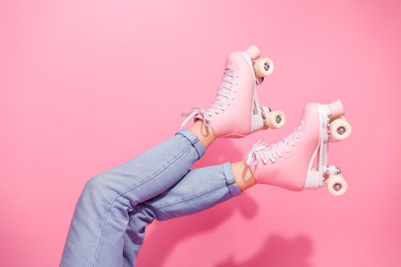 Trendy Pink Roller Skates on a Vibrant Background Capturing Retro Styleの写真素材