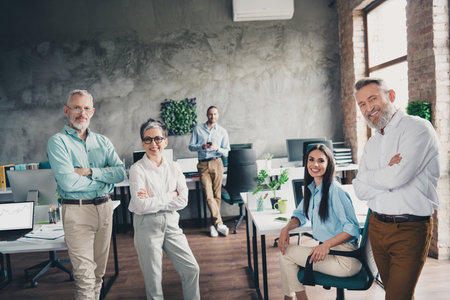 Photo of teamwork people working together crossed hands confident comfortable modern office loft room interior indoors workspaceの写真素材