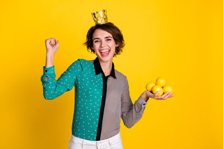 Photo of charming positive woman wear trendy clothes isolated on yellow color backgroundの写真素材