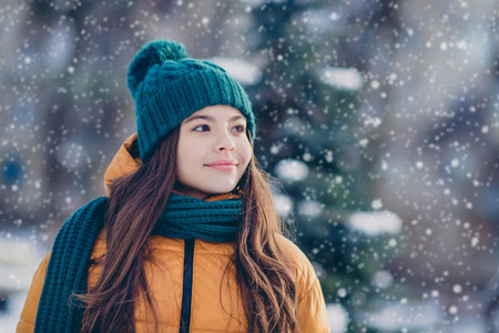 Photo of adorable girl wear windbreaker jacket enjoying walking green snowy countryside forestの写真素材