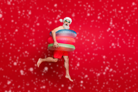 Full length body size view of nice handsome cheerful cheery funky glad positive comic childish playful wondered bearded gray-haired man hurry rush isolated on bright vivid shine red backgroundの写真素材