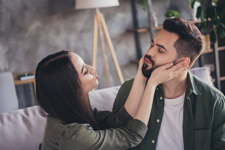 Photo of adorable young loving sweet couple enjoying time together modern loft interior apartment...