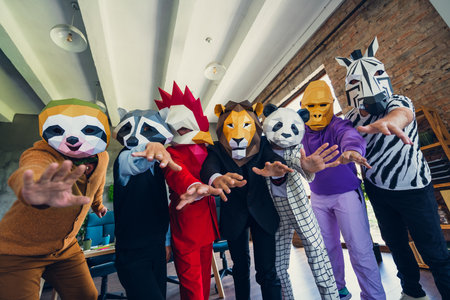 Portrait of business people raise arms camera you loft business center indoorsの写真素材