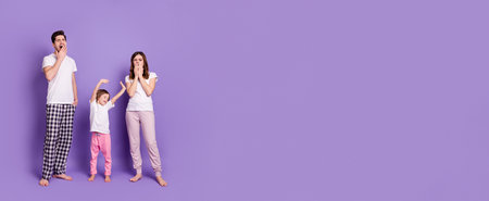 Full length body size view of nice sleepy family dad mom offspring daughter wearing pajama waking up stretching yawning day-off dreaming isolated bright vivid shine vibrant violet color backgroundの写真素材