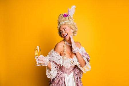 Elegant woman in vintage costume with yellow background