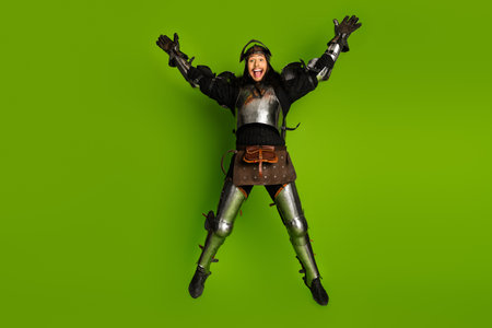 Man in medieval armor joyfully jumping with green background symbolizing modern twist on classic...