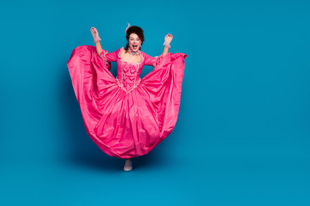 Full length photo of impressed woman wear corset dress having fun empty space isolated blue color...