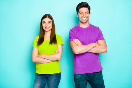 Portrait of attractive lovely charming cute cheerful cheery shy couple looking at each other folded...