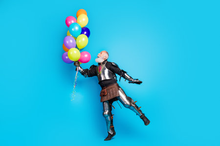 Elderly knight dressed in armor enjoying a playful moment with colorful balloons against a bright...