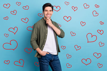 Photo of minded smart reliable professional guy marketer decide idea touch hands chin isolated on blue color backgroundの写真素材