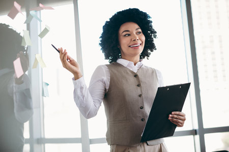 Successful businesswoman presenting ideas during a meeting in a modern office environment