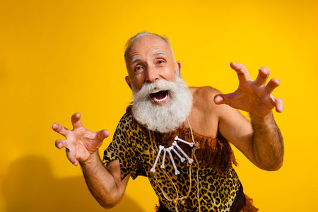 Photo of ancient aged caveman hands scare scream wear leopard skin clothes isolated on yellow color...