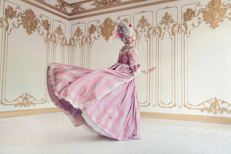 Elegant young woman in baroque gown twirls gracefully in ornate room, capturing the essence of...