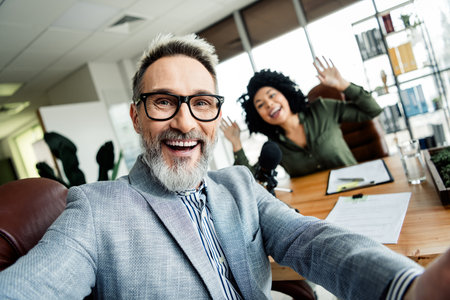 Modern office coworkers collaborating with enthusiasm and professionalism in a vibrant workspace fostering teamwork and creativityの写真素材