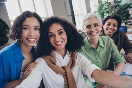 Photo of corporate four colleagues women feminists community leadership take selfie photo meeting...
