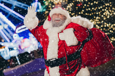 Photo of funky good old man grandpa waving hand ready night adventure present miracle everyone midnight coming newyear spirit outdoorの写真素材