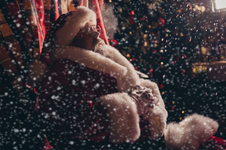 Profile side photo of wise old retired man santa Ñlaus sitting residence village listening people dreams wishes magic moment season outdoorの写真素材