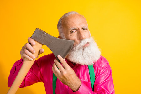 Photo portrait of fashionable old gentleman cut mustache axe wear glamour garment suspenders isolated bright yellow color backgroundの写真素材