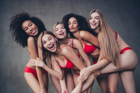 No filter photo of group lovely stunning girls embrace cuddle harmony self acceptance love on concrete wall studio backgroundの写真素材