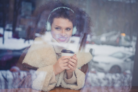 Portrait of nice young girl hold cacao look window outdoors winter holiday weekend cafe coffee shop...