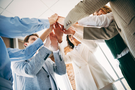 Group of professionals in formal attire, showcasing teamwork and collaboration in a modern office settingの写真素材