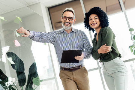 Diverse coworkers collaborating in a professional office setting showcasing teamwork and partnership