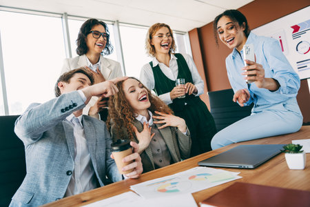 Diverse Business Team Sharing a Lively Moment at the Office During Breakの写真素材