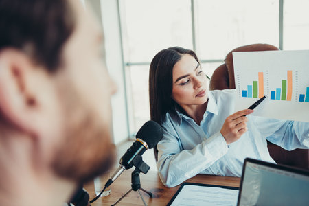 Professional business discussion in a modern coworking space focusing on data analytics and teamwork...
