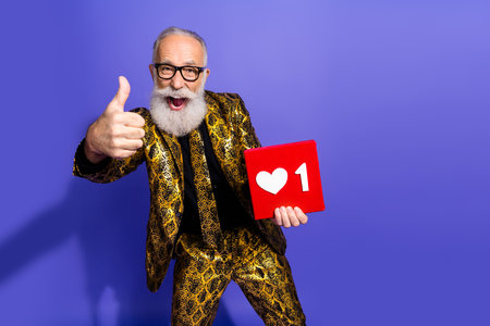 Charismatic elderly man showcasing a stylish patterned suit with symbolic social media support icon...