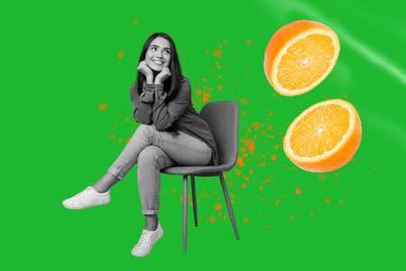 Banner art collage of person sit chair look levitate with orange slice over green color backgroundの写真素材