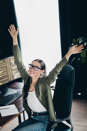 Professional computer programmer enjoying success while working remotely in a home office...